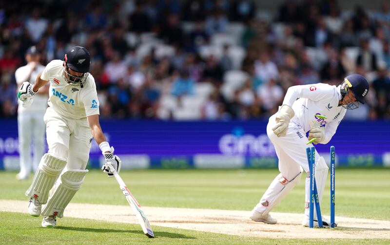 New Zealand's Daryl Mitchell makes his ground as stand-in England keeper Sam Billings attempts a run out. PA