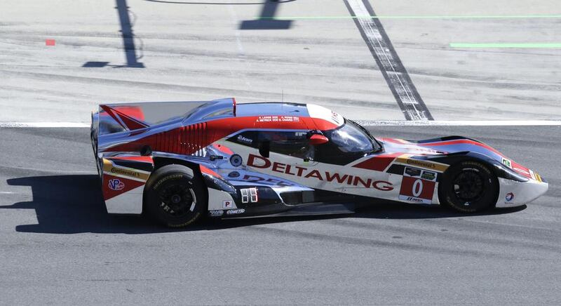Andy Meyrick, of England, drives the DeltaWing DWC13 down pit road before the start of the IMSA Series Rolex 24 hour auto race at Daytona International Speedway on Saturday. John Raoux / AP