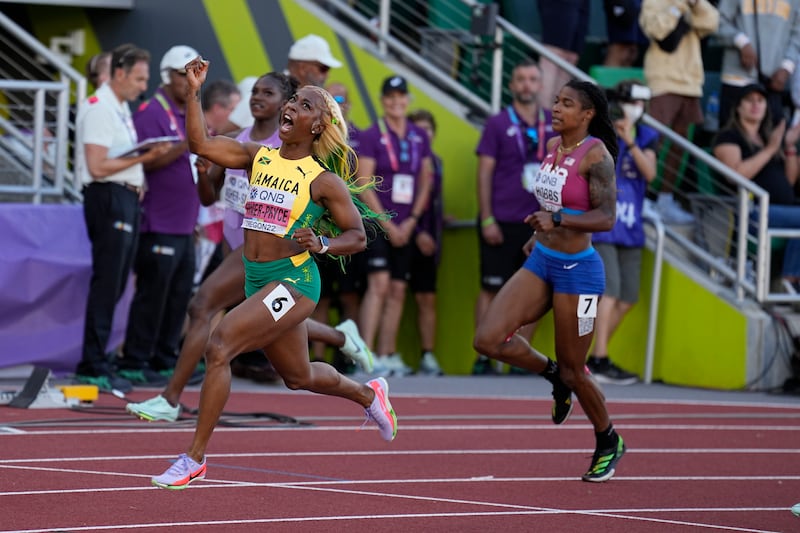 Shelly-Ann Fraser-Pryce reacts after winning gold in the final of the women's 100-metre at the World Athletics Championships. AP