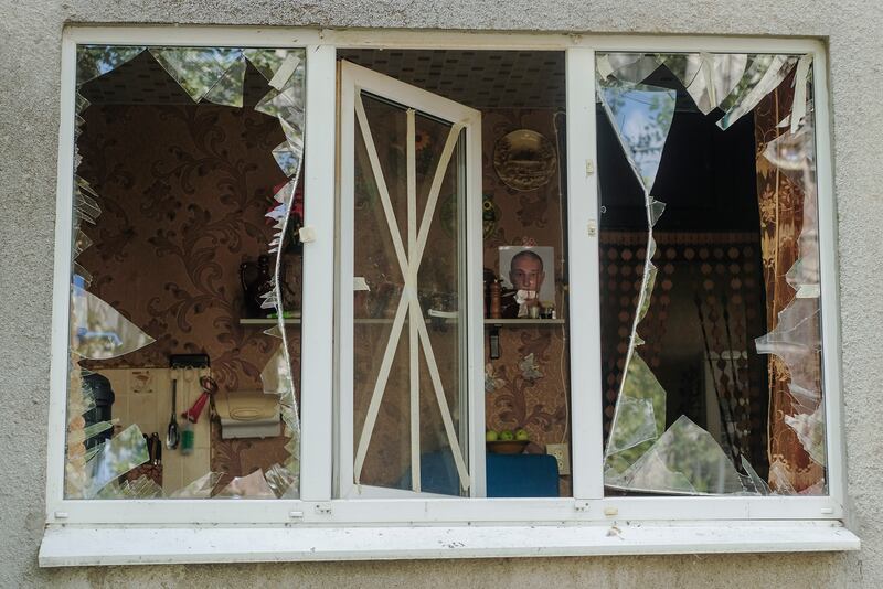 The damaged windows of an apartment, after shells hit a residential area in Kramatorsk. EPA
