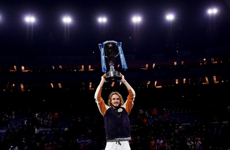 Stefanos Tsitsipas celebrates with the trophy after winning against Dominic Thiem on day eight of the Nitto ATP Finals at The O2 Arena, London. PA Photo. Picture date: Sunday November 17, 2019. See PA story TENNIS London. Photo credit should read: John Walton/PA Wire. RESTRICTIONS: Editorial use only, No commercial use without prior permission.