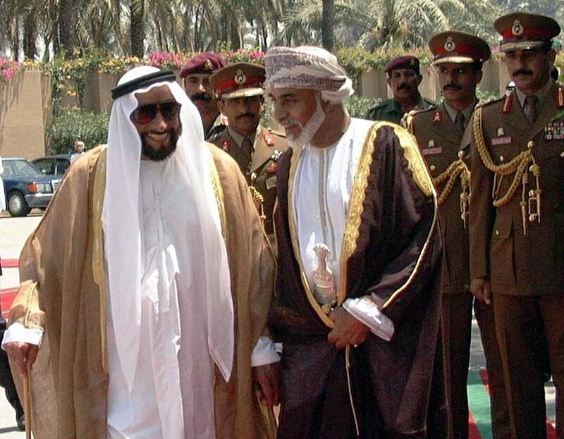 Omani Sultan Qaboos (R) walks with Emirati President Sheikh Zayed ibn Sultan al-Nahayan in Sohar 01 May 1999. The two leaders signed an accord laying out the demarcation of part of their common border, which in the past has led to conflicts over property ownership between nationals of the two countries. (Photo by WAM / AFP)