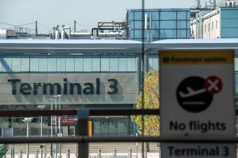 LONDON, ENGLAND - JUNE 01: A sign indicates that Heathrow Terminal 3 building is closed to passengers as it is set aside for red list arrivals at Heathrow Airport on June 1, 2021 in London, England. Heathrow's Terminal 3 will now be reserved for direct arrivals from countries on the British government's "red list," from which travelers are subject to a 10-day hotel quarantine. Previously, there was concern about "red list" arrivals queueing in Heathrow terminals alongside travelers from countries with a lower Covid-19 risk profile. (Photo by Chris J Ratcliffe/Getty Images)