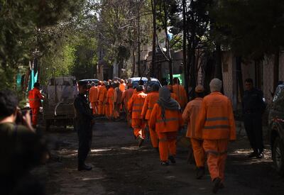 Afghan municipality workers arrive to clear up the site of an attack by Taliban militants, a day after the assault on a compound housing an international aid organisation, in Kabul on May 9, 2019. Taliban militants stormed a US-funded aid group's central Kabul compound on May 8, having targeted the organisation for promoting Western culture and the "inter-mixing" of men and women.

 / AFP / WAKIL KOHSAR
