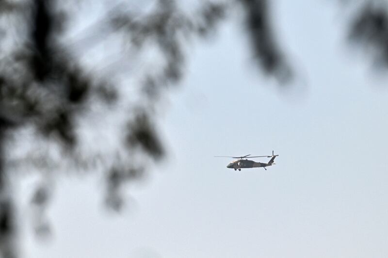 A helicopter flies over Kabul, after Afghanistan's capital was hit by two explosions. AFP