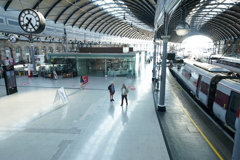 Passengers at a near empty Newcastle station on Thursday morning, as train services continue to be disrupted following the nationwide strike by members of the Rail, Maritime and Transport union. PA