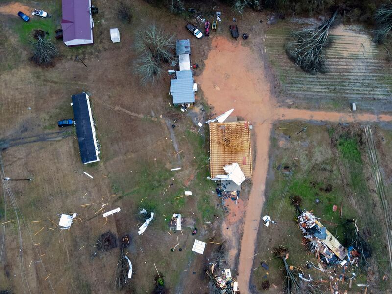 A giant storm system across the South spurred a tornado that shredded the walls of homes and toppled roofs in many towns in Alabama. AP