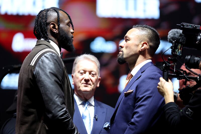 Deontay Wilder, left, and Joseph Parker size each other up. Getty Images