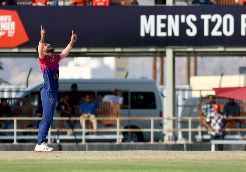 Muhammad Farooq of the UAE celebrates a wicket.