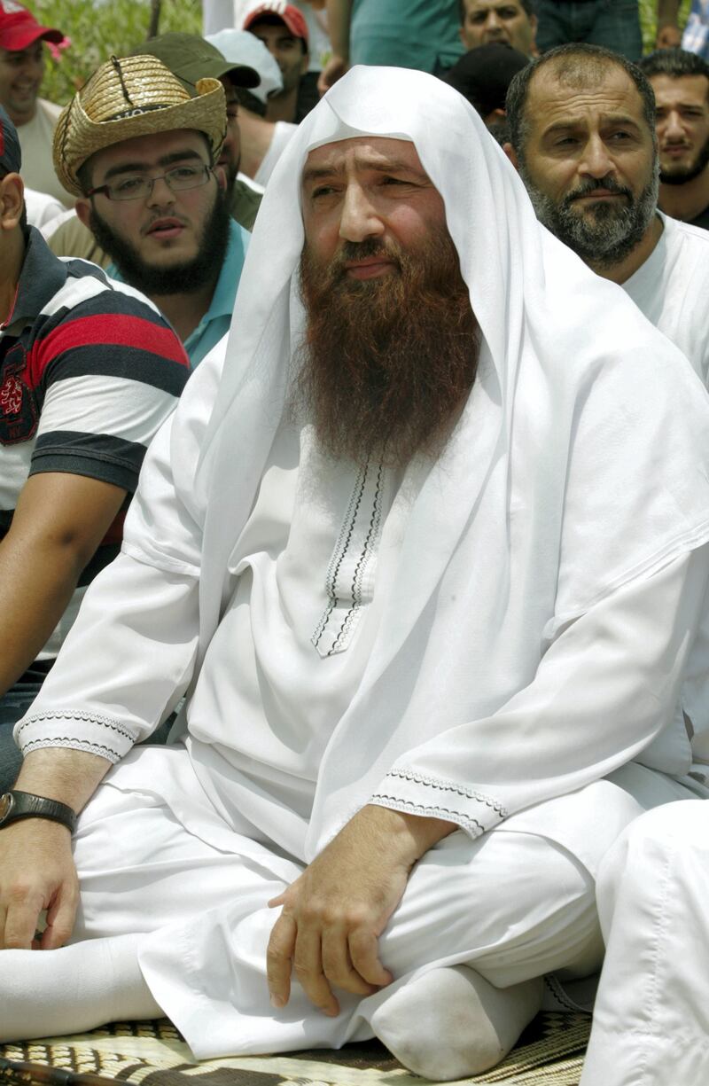 Radical cleric Omar Bakri, on bail in Lebanon on charges including incitement to murder, attends a sit-in in the southern Lebanese port city of Sidon on June 29, 2012, demanding the disarming of the Shiite militant group Hezbollah, considered the most powerful military force in the country. The Syrian-born cleric and holder of Lebanese nationality, who earned notoriety by praising the September 11, 2001 attacks on the United States, was banned in 2005 from returning to Britain, where he was based for nearly two decades, under government curbs introduced following the London underground and bus bombings that year. AFP PHOTO/MAHMOUD ZAYYAT (Photo by MAHMOUD ZAYYAT / AFP)