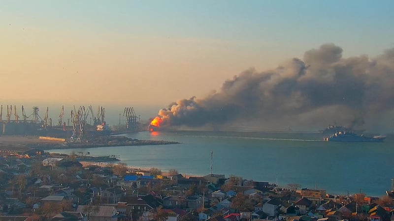 Smoke billows from a fire on what the Ukrainian Ministry of Defence says is a Russian warship at the port of Berdiansk, Ukraine. Reuters