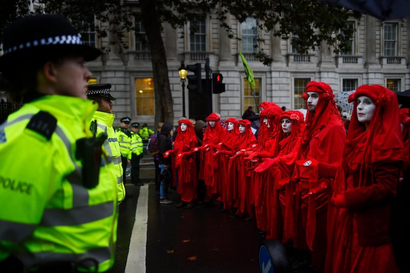 Climate change activists in London block access to various government departments as they start a two week protest. Photo by Peter Summers/Getty Images