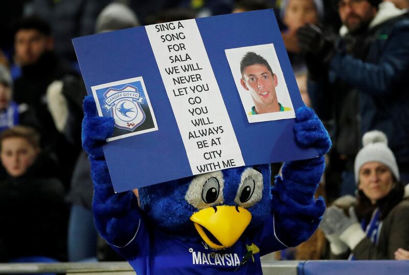 Cardiff mascot Bartley Bluebird displays a banner paying tribute to Sala during the match. Action Images via Reuters
