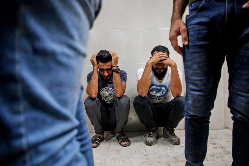 Relatives of Palestinian Zaki Ghanama, 25, mourn in the morgue of a hospital in Beit Lahia in the northern Gaza Strip. AFP