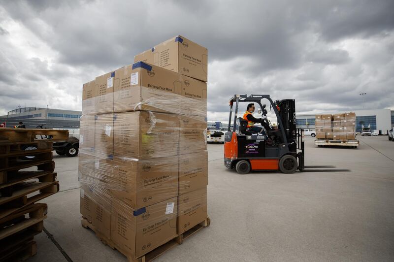 Workers unload a shipment of medical supplies from an Antonov AN-225 Mriya aircraft at Toronto Pearson International Airport in Toronto, Ontario, Canada, on Saturday, May 30, 2020. Bloomberg
