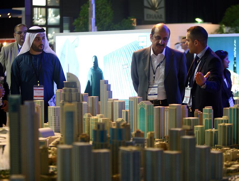 Dubai , United Arab Emirates- September 27,  2011:    Visitors browse the  Emaar Properties,  Down Town Dubai Projects  at  the Cityscape Global in Dubai.  ( Satish Kumar / The National ) For Business