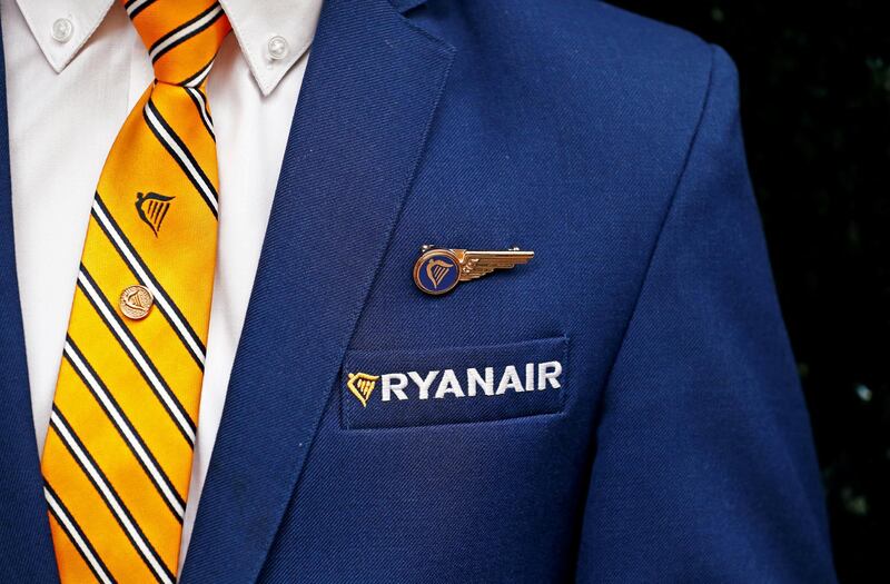 FILE PHOTO: A Ryanair cabin crew member poses ahead of a news conference by Ryanair union representatives in Brussels, Belgium September 13, 2018.   REUTERS/Francois Lenoir/File Photo