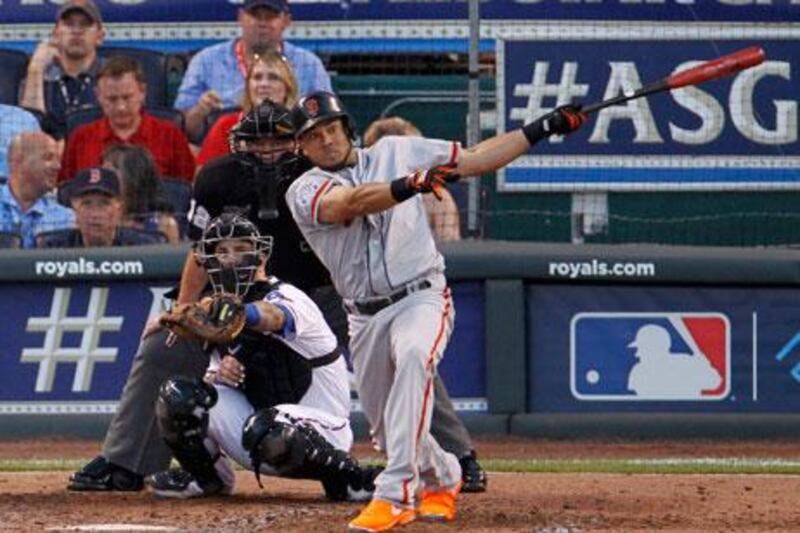 National League player Melky Cabrera hits his two-run homer against the AL All-Star Team