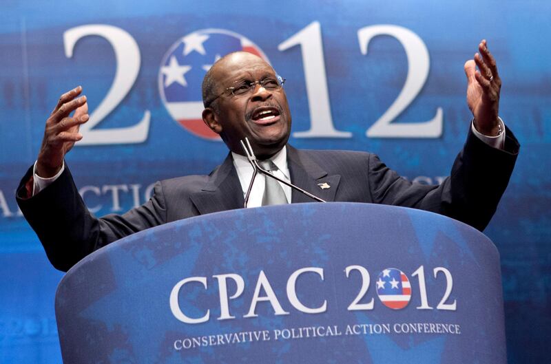 FILE - In this Feb. 9, 2012 file photo, former presidential candidate Herman Cain addresses the Conservative Political Action Conference in Washington.  Cain has died after battling the coronavirus. A post on Cain's Twitter account on Thursday, July 30, 2020 announced the death.   (AP Photo/J. Scott Applewhite, File)