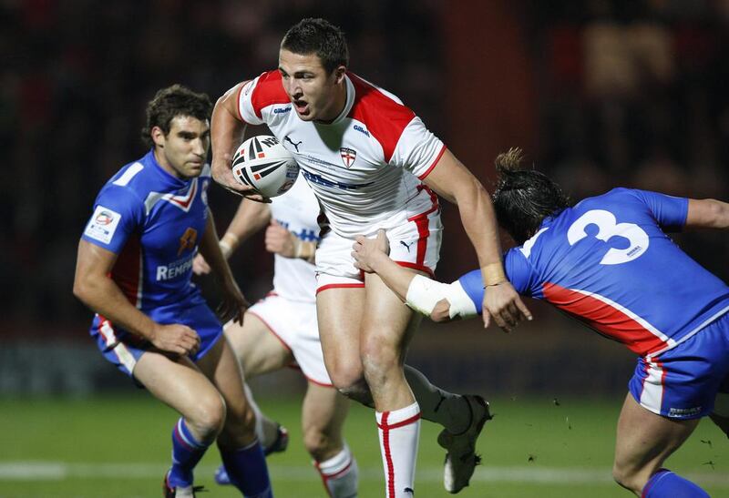 England's Sam Burgess, centre, pictured playing against France on Oct. 23, 2009, is switching rugby codes, from league to union, in a bid to become a World Cup winner with England in 2015. Jon Super / AP Photo