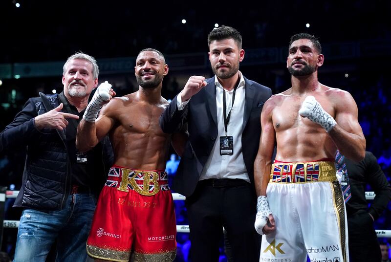 Kell Brook (second left) with Terry Thompson (left), promoter Ben Shalom and Amir Khan after the fight. PA