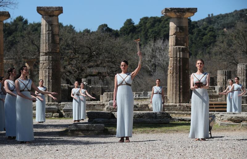 Greek actress Xanthi Georgiou, playing the role of High Priestess, lights the flame during the Olympic flame lighting ceremony. Reuters