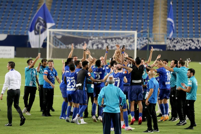 Players and coaching staff of Al Hilal celebrate winning the Saudi Pro League title.