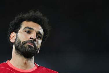 Liverpool's Egyptian midfielder Mohamed Salah reacts during the UEFA Champions League quarter final second leg football match between Liverpool and Benfica at the Anfield stadium, in Liverpool, on April 13, 2022.  (Photo by Paul ELLIS  /  AFP)