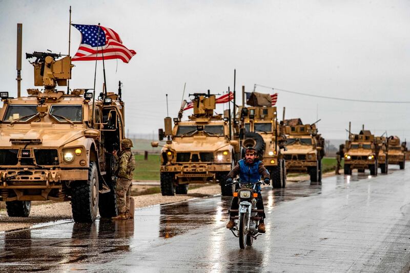 American soldiers patrol on the M4 highway in the town of Tal Tamr in the northeastern Syrian Hasakeh province on the border with Turkey on January 24, 2020.  / AFP / Delil SOULEIMAN
