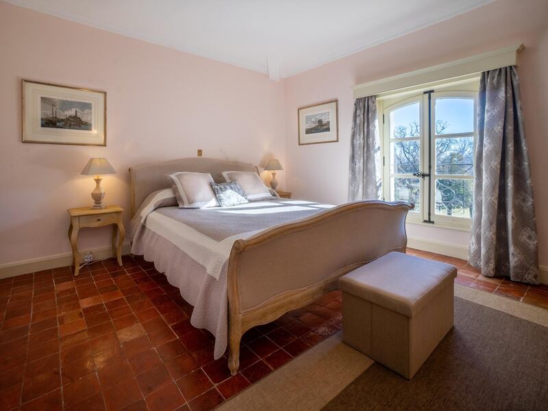 Guest bedrooms boast views of the grounds. Courtesy Chateau De Tourreau