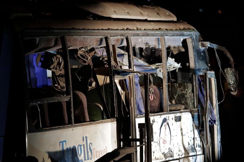 The damaged bus after a roadside bomb in an area near the Giza Pyramids in Cairo. AP Photo