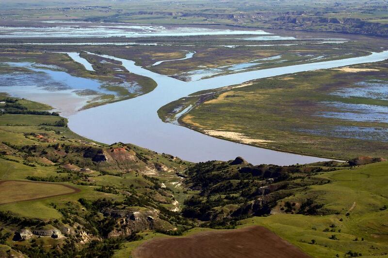 The Missouri river winds through the countryside near Williston, North Dakota, which is the epicentre of the oil boom. Charles Rex Arbogast / AP Photo