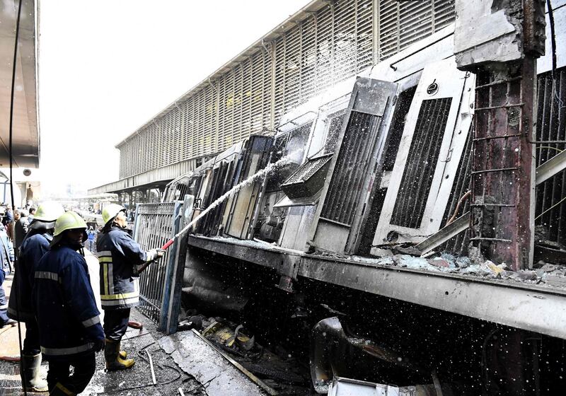 Fire fighters gather at the scene. AFP