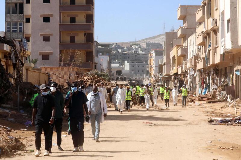 Volunteers amid the ruins and damaged homes after the Mediterranean Storm Daniel hit Libya's eastern city of Derna. AFP