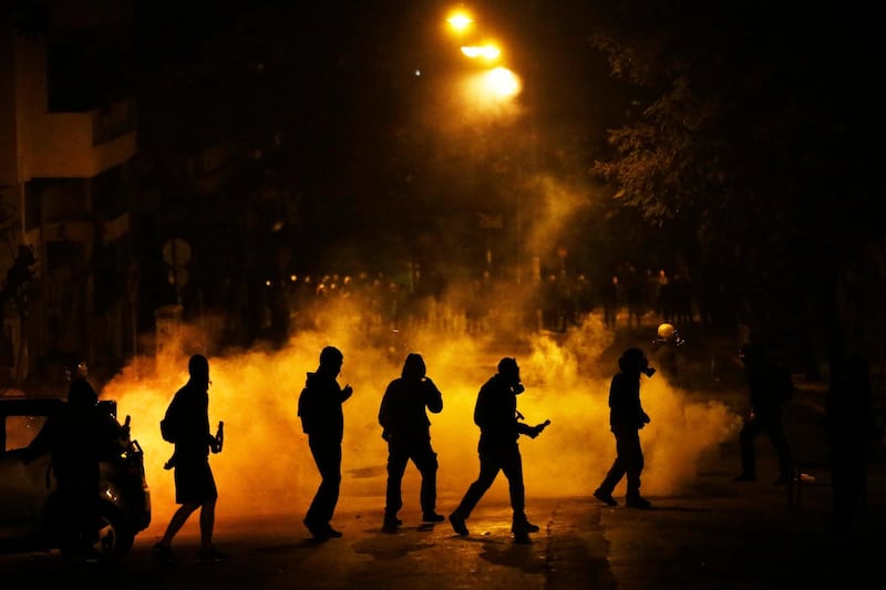 Protesters clash with riot police after a demonstration in Athens, Greece. Yannis Kolesidis / EPA