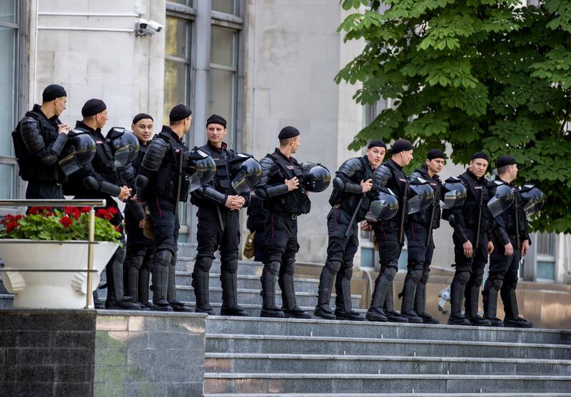 epa07637589 Riot police block the entrance to the Government building in Chisinau, Moldova, 09 June 2019. After forming the majority on 08 June, the parliament voted the Socialist Zinaida Grecianii as Speaker and Maia Sandu as Prime Minister. The Democratic Party tries to mentain her position and power in old government, and uses the Constitutional Court to block all decision of new Government.  EPA/DUMITRU DORU