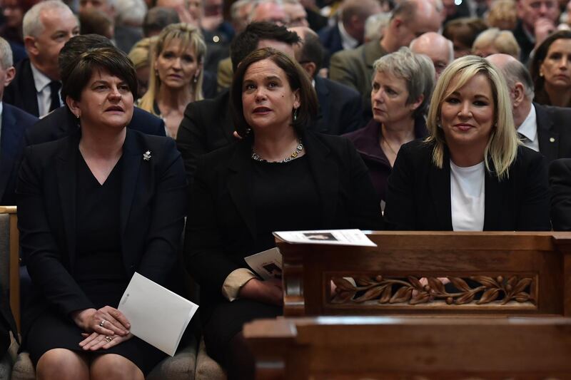 Arlene Foster, leader of the DUP, Mary Lou McDonald, Leader of Sinn Fein and Michelle O'Neill, Vice President of Sinn Fein attend the funeral service. Getty Images