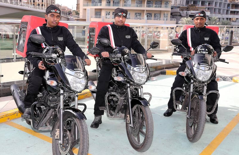 DUBAI , UNITED ARAB EMIRATES ,  November 8 , 2018 :- Left to Right – Ranil Suresh , Sajjad Ahmad and Didar Ul Haque delivery bikers with their bikes at the Freedom Pizza in Dubai Marina in Dubai.  ( Pawan Singh / The National )  For News. Story by Patrick Ryan