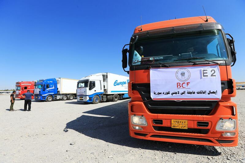 Trucks loaded with humanitarian aid are seen heading to Syria for displaced families who fled violence, at the Iraqi-Syrian border crossing in Fish-Khabur, Iraq. REUTERS