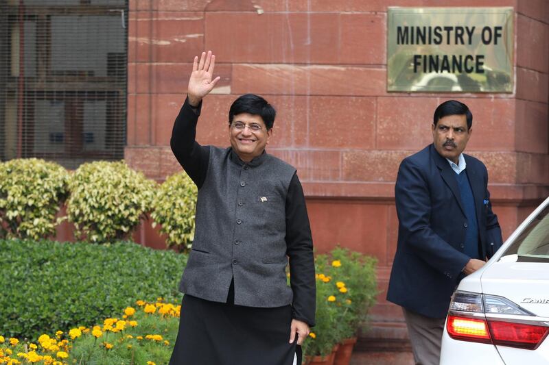 Piyush Goyal, India's interim finance minister, waves as he arrives at the North Block of the Central Secretariat building in New Delhi, India, on Friday, Feb. 1, 2019. India's government will breach its budget deficit target for a second year as Prime Minister Narendra Modi tries to woo voters before an election with more spending. Photographer: T. Narayan/Bloomberg