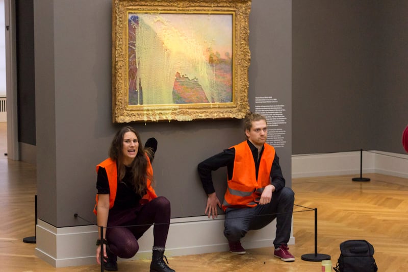 Climate protesters of Last Generation after throwing mashed potatoes at the Claude Monet painting 'Les Meules' at Potsdam’s Barberini Museum on October 24. AP
