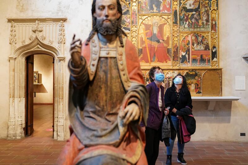 Visitors and staff observe Covid-19 prevention protocols in halls of The Met Cloisters, a branch of the Metropolitan Museum of Art dedicated to medieval European art, in New York. AP Photo