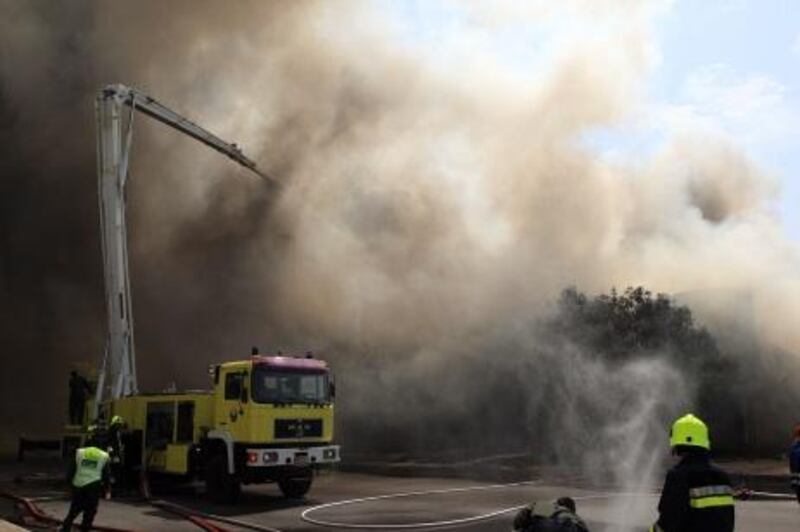 ABU DHABI - 29MAR 2012 - Fire broke out in eight warehouses on Mina port yesterday in Abu Dhabi. Ravindranath K / The National 