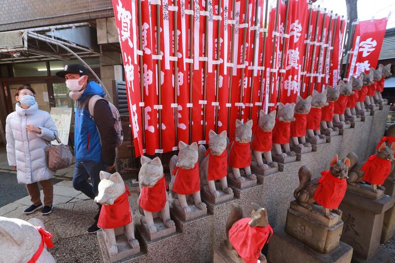 People visit a local shrine in Tokyo, Japan. AP