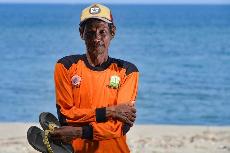 Muhammad Saleh, a survivor of the December 26, 2004 tsunami, stands on the beach near his village at Lambada, Aceh province.  AFP