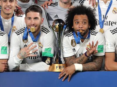 Abu Dhabi, United Arab Emirates - December 22, 2018: Real Madrid's Sergio Ramos and Marcelo (R) celebrate winning the cup after the match between Real Madrid and Al Ain at the Fifa Club World Cup final. Saturday the 22nd of December 2018 at the Zayed Sports City Stadium, Abu Dhabi. Chris Whiteoak / The National