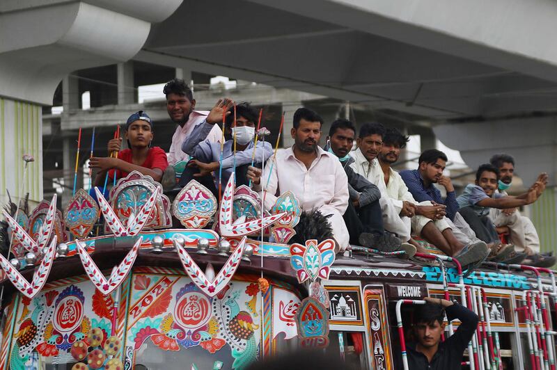 People ride a bus in Karachi, Pakistan. EPA