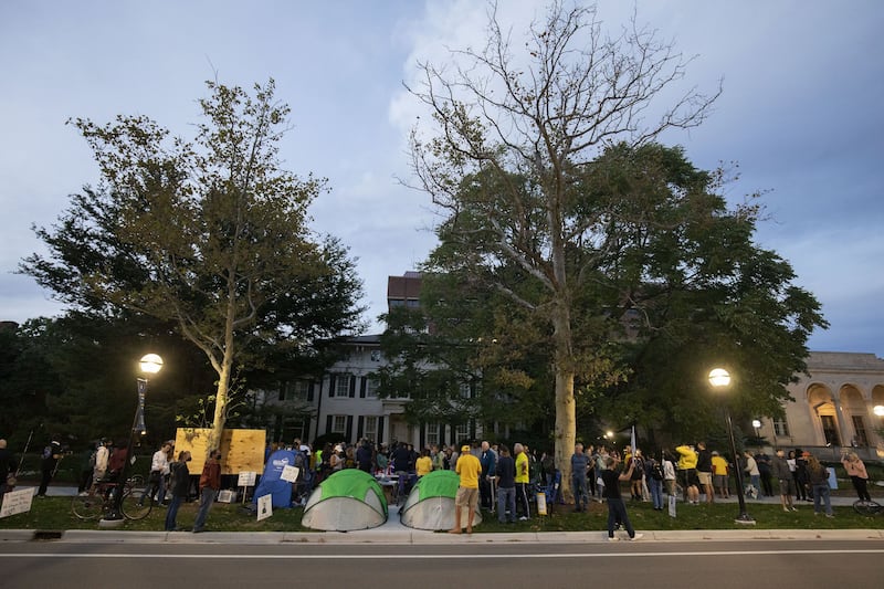 A vigil for victims of sexual abuse, including those assaulted by Nassar, is held across the street from the home of departing University of Michigan President Mark Schlissel in Ann Arbor, Michigan, in October 2021. Getty / AFP
