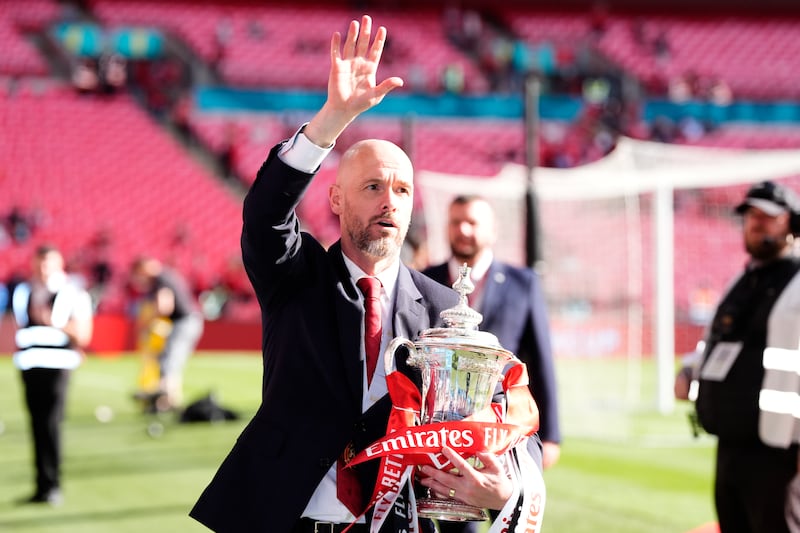 Manchester United manager Erik ten Hag with the trophy. PA