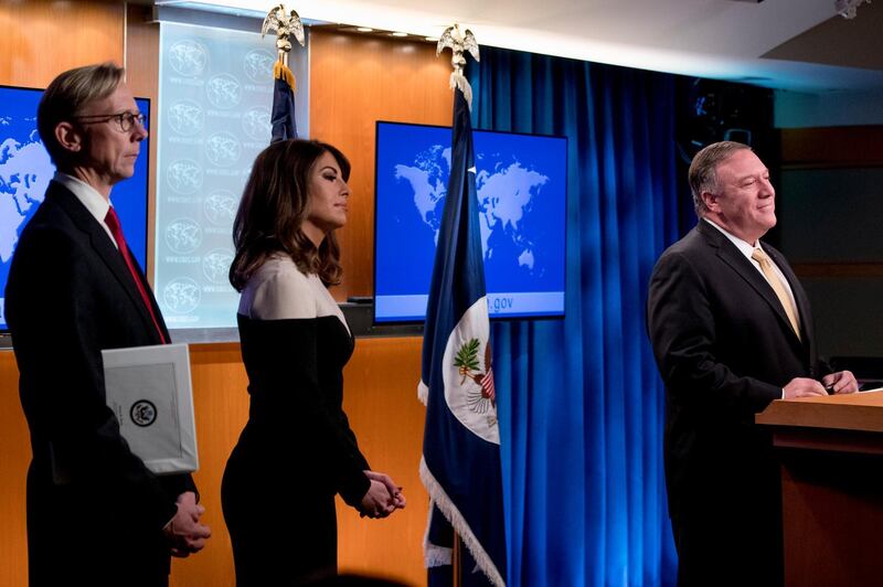 Secretary of State Mike Pompeo, right, accompanied by US special representative on Iran Brian Hook and State Department spokeswoman Morgan Ortagus  takes a question from a reporter during a news conference at the State Department in Washington. AP Photo